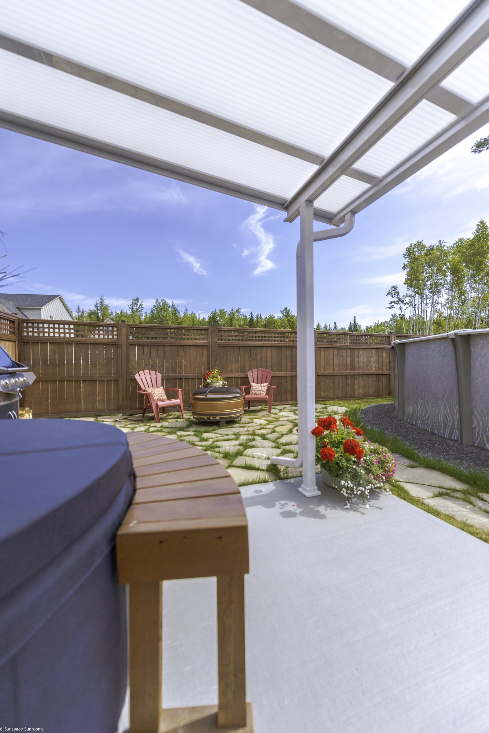 Freestanding wooden pavilion patio cover with skylights and fireplace